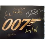 007 James Bond multiple signed 14x11 inch photo