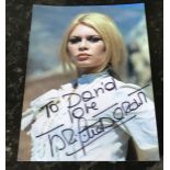 Brigitte Bardot signed 6 x 4 inch colour photo to David. Condition 7/10. All autographs come with