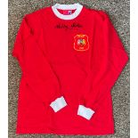 Football Nobby Stiles signed Manchester United 1963 Wembley retro replica shirt. Good condition. All