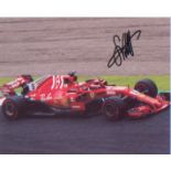 Sebastian Vettel signed 10 x 8 inch photo picture during F1 race. Good condition. All autographs