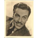 Cesar Romero signed 6 x 7 sepia photo in reasonable condition with slightly torn top corner and