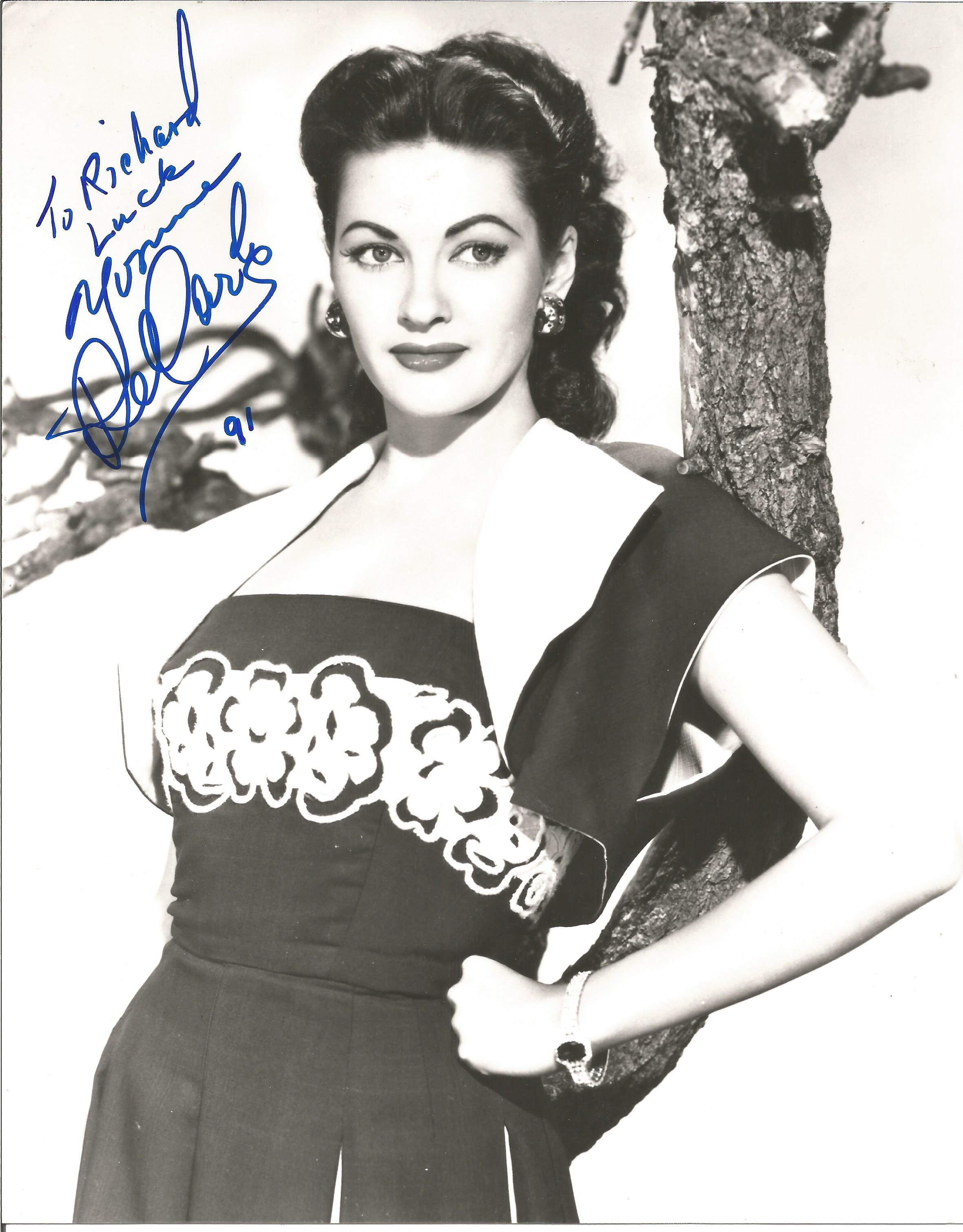 Yvonne De Carlo signed 10x8 black and white photo dedicated. Good condition. All autographs come