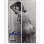 007 Bond girl Lana Wood signed photo, desirable image of her naked in the shower. Good condition.