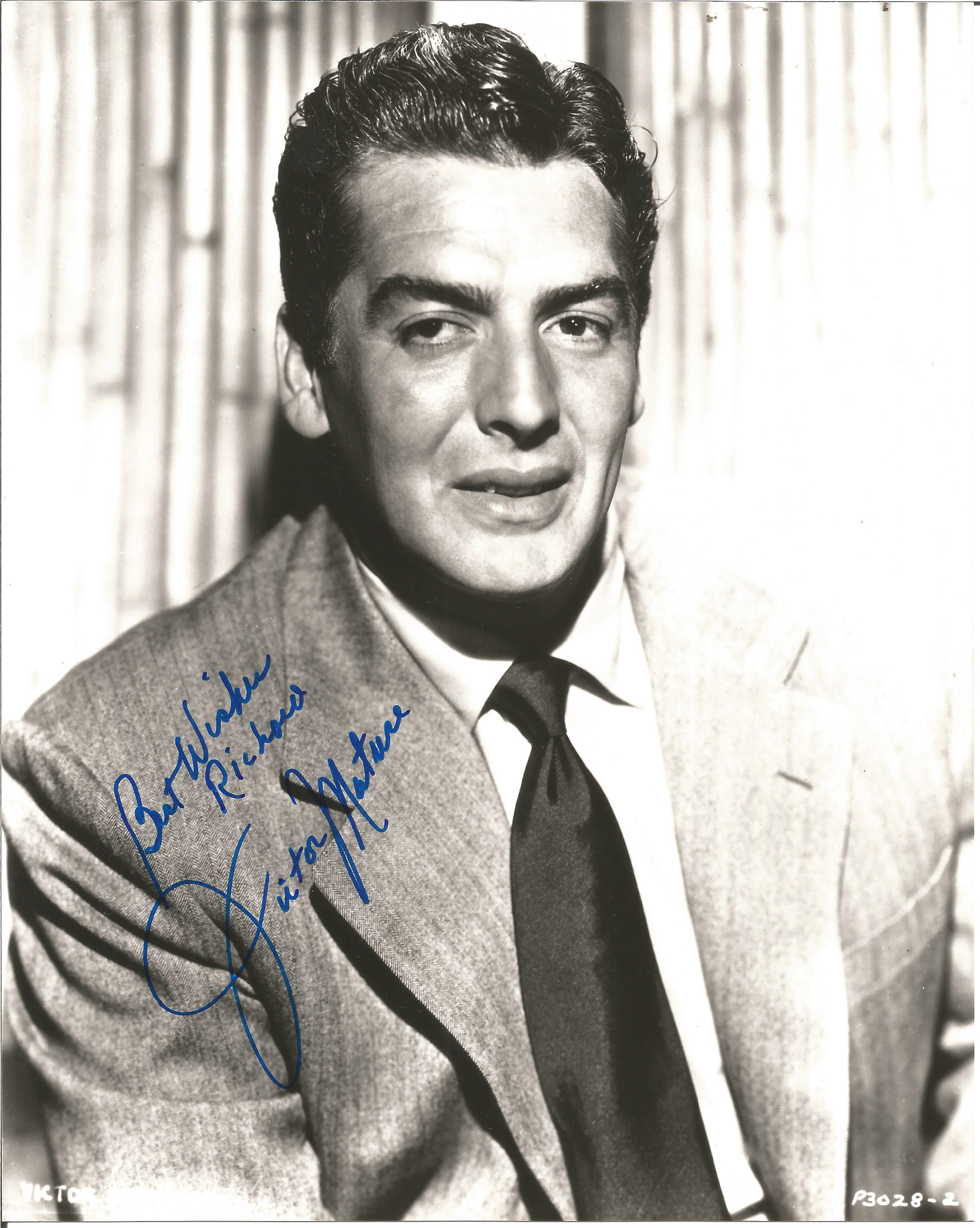 Victor Mature signed 10x8 black and white photo dedicated. Good condition. All autographs come