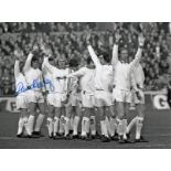 Autographed David Harvey 8 X 6 Photo - B/W, Depicting Leeds United Players Saluting Their Supporters