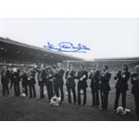 Autographed Jack Charlton 8 X 6 Photo - B/W, Depicting Leeds United Players Standing Shoulder To