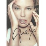 Kylie Minogue signed 6x4 colour promo photo. Kylie Ann Minogue AO , OBE ( born 28 May 1968) , also