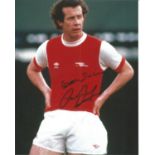 Liam Brady signed 10x8 colour image. Taken during his Arsenal days.. Good condition. All