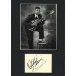 BB King signature piece mounted below black and white photo. Approx overall size 16x12. Good