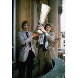 Autographed Ipswich 12 X 8 Photo Col, Depicting Frans Thijssen And Arnold Muhren Holding Aloft The