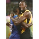 Usain Bolt and Justin Gatlin signed 12x8 colour photo. Good condition. All autographs come with a