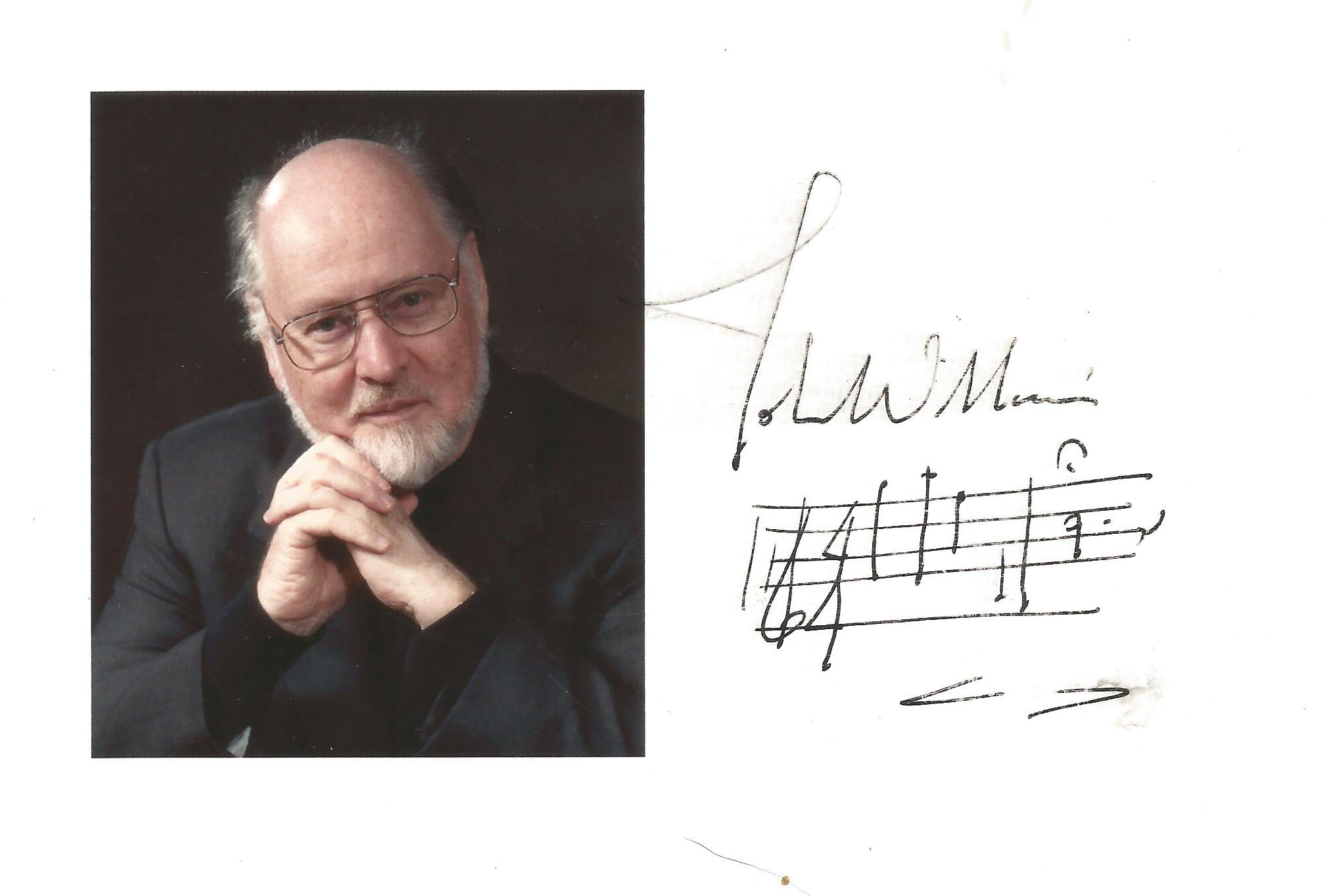 John Williams signature piece featuring a photograph and a music score. Williams has composed some