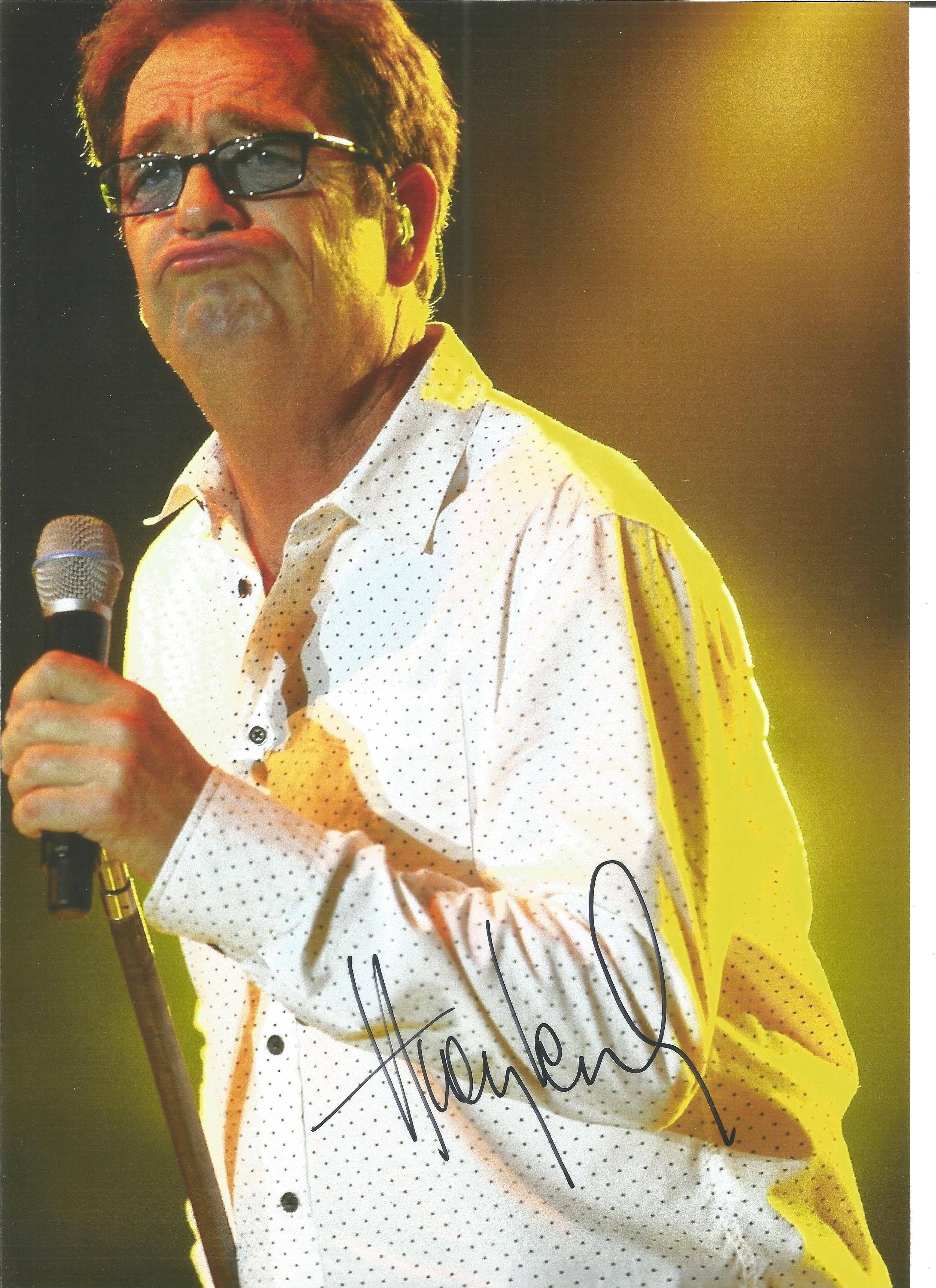 Huey Lewis signed 10x8 colour photo. Image taken during one of his many performances. Good