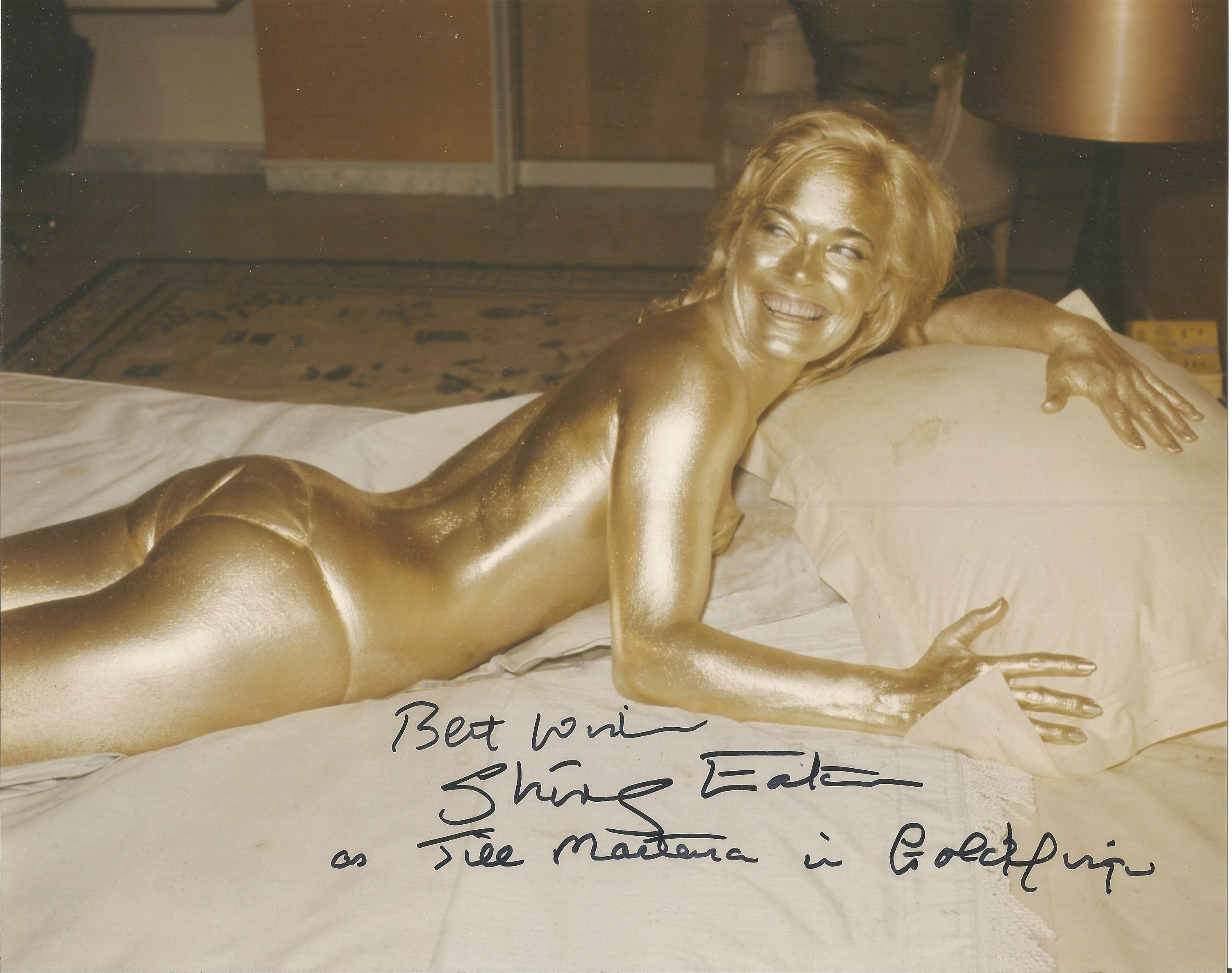 Shirley Eaton Goldfinger signed 10 x 8 inch colour photo on bed covered in gold, inscribed with