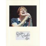 Paolo Nutini signed card piece. Photo attached. 16 x 12. Good condition. All autographs come with