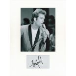 Huey Lewis signed card piece. Photo attached. 16 x 12. Good condition. All autographs come with a