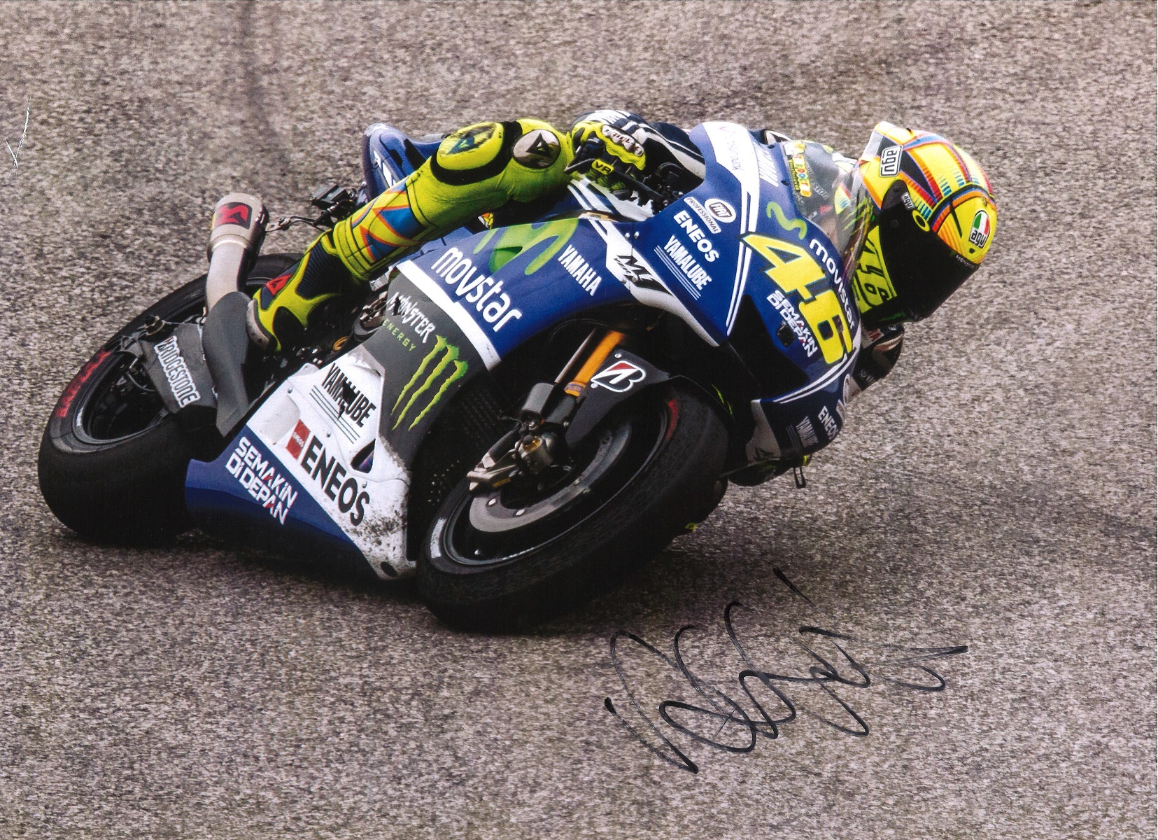 Valentino Rossi signed 16x12 colour photo picturing the 9 times Moto GP world champion in action.