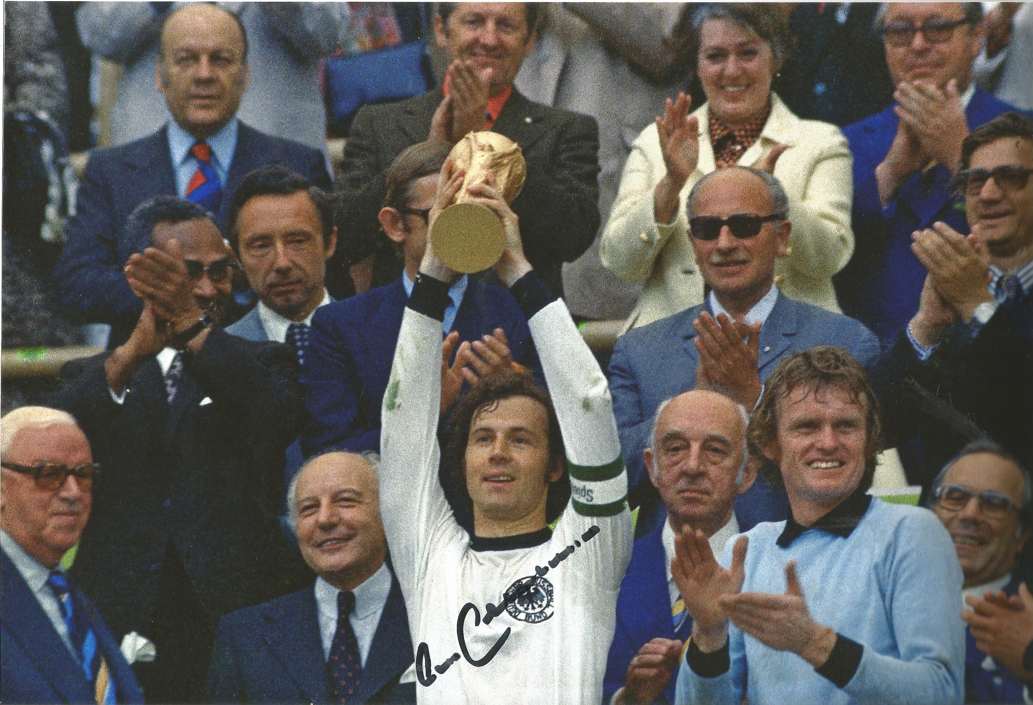 Franz Beckenbauer signed 12x8 colour photo pictured lifting the world cup for West Germany in