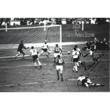Football Martin Peters signed 12x8 black and white photo pictured scoring in the 1966 World Cup