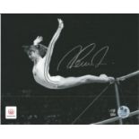 Gymnast Nadia Comaneci signed official Olympics 10 x 8 inch b/w photo flying through the air. Good