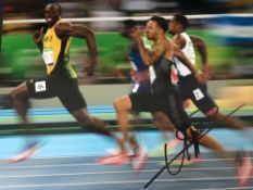 Usain Bolt Two Large 14 X 11 Inch Colour Photographs Of The Jamaican Sprint Legend. Good