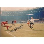 Sir Geoff Hurst signed 12x8 colour photo pictured in action during the 1966 world cup final. Good