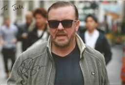 Ricky Gervais signed 12x8 colour photo. Dedicated. Good condition. All autographs come with a