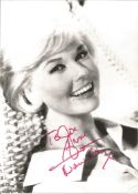 Doris Day signed 7x5 black and white photo. Dedicated. Good condition. All autographs come with a