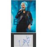 Emeli Sande signature piece in autograph presentation. Mounted with photograph to approx. 16 x 12