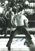 John Travolta signed 12x8 black and white photo. Slight knock to top right corner not affecting