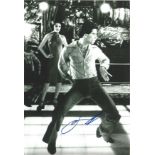 John Travolta signed 12x8 black and white photo. Slight knock to top right corner not affecting