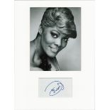 Dionne Warwick signed card piece. Mounted with photograph to approx. 16 x 12 inches. Good condition.