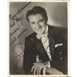 Liberace signed 10x8 black and white photo. Showing signs of age. Slight rip to top centre and few