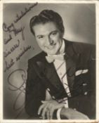 Liberace signed 10x8 black and white photo. Showing signs of age. Slight rip to top centre and few
