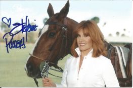 Stephanie Powers signed 6x4 colour photo with horse. Good condition. All autographs come with a