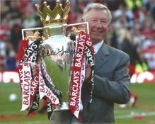 Alex Ferguson signed 10x8 colour photo holding the Premier league trophy. Good condition. All