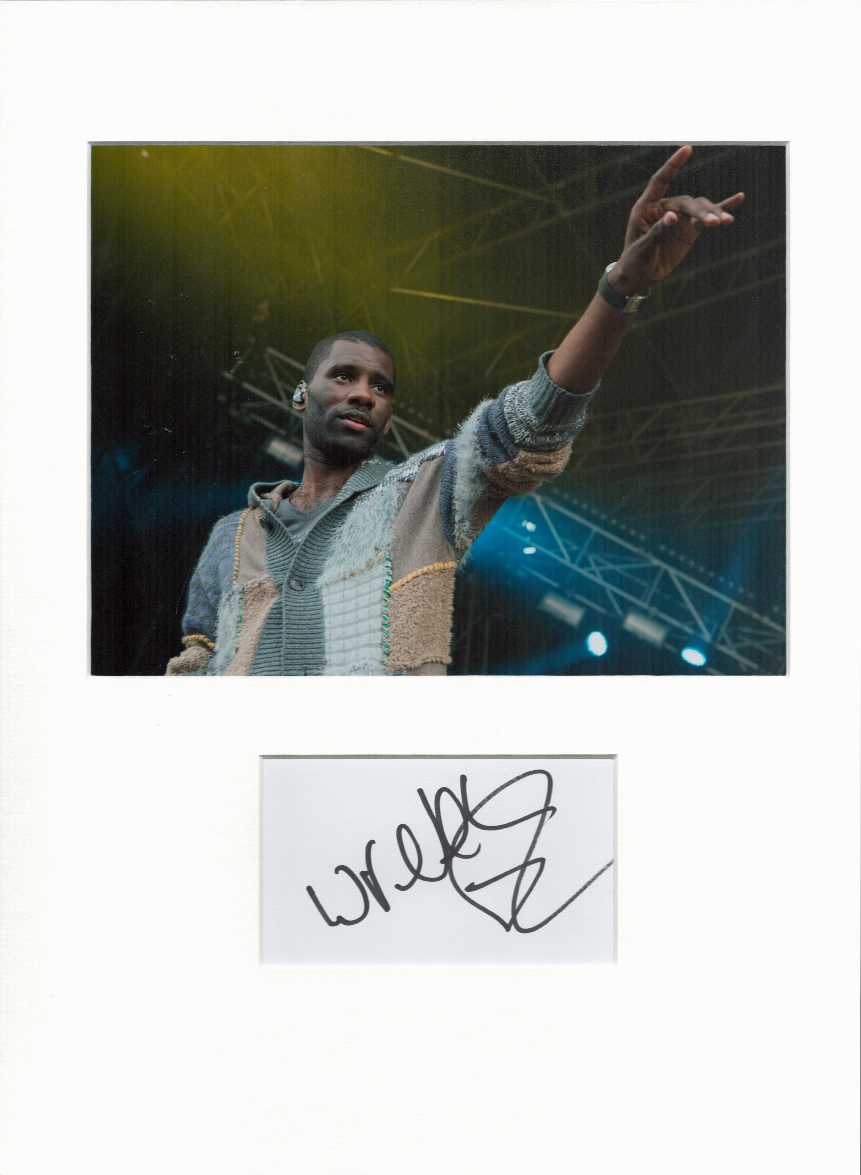 Wretch 32 signature piece in autograph presentation. Mounted with photograph to approx. 16 x 12