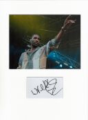 Wretch 32 signature piece in autograph presentation. Mounted with photograph to approx. 16 x 12