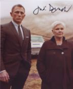 Judi Dench signed 10 x 8 inch photo in character from Bond. Good condition. All autographs come with