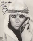 007 Bond girl Caroline Munro signed sexy pose 8x10 photo. Good condition. All autographs come with a