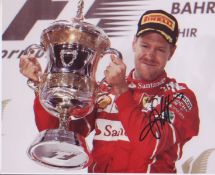 Sebastian Vettel 10x8 signed photo holding trophy. Good condition. All autographs come with a