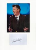 Rick Astley signature piece in autograph presentation. Mounted with photograph to approx. 16 x 12