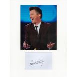 Rick Astley signature piece in autograph presentation. Mounted with photograph to approx. 16 x 12