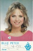 Janet Ellis. TV presenter. Signed 6" by 4" Blue Peter cast card. Good condition. All autographs come