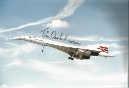 Concorde pilot Captain Tim Orchard signed 12 x 8 inch colour photo of Concorde in flight with nose