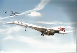 Concorde pilot Captain Roger Britten signed 12 x 8 inch colour photo of Concorde in flight with nose