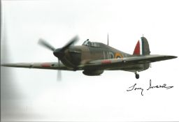 WW2 fighter ace Tony Iveson signed 12 x 8 inch colour photo of a Spitfire in flight. Good condition.