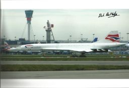 Concorde pilot Capt Dick Routledge signed 12 x 8 inch colour photo of Concorde on tarmac parked..