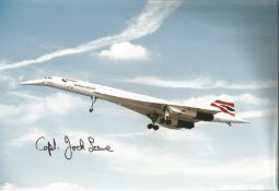 Concorde pilot Captain Jock Lowe signed 12 x 8 inch colour photo of Concorde in flight with nose