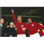 Geoff Hurst signed 12 x 8 inch colour 1966 World Cup final football photo, standing next to Bobby